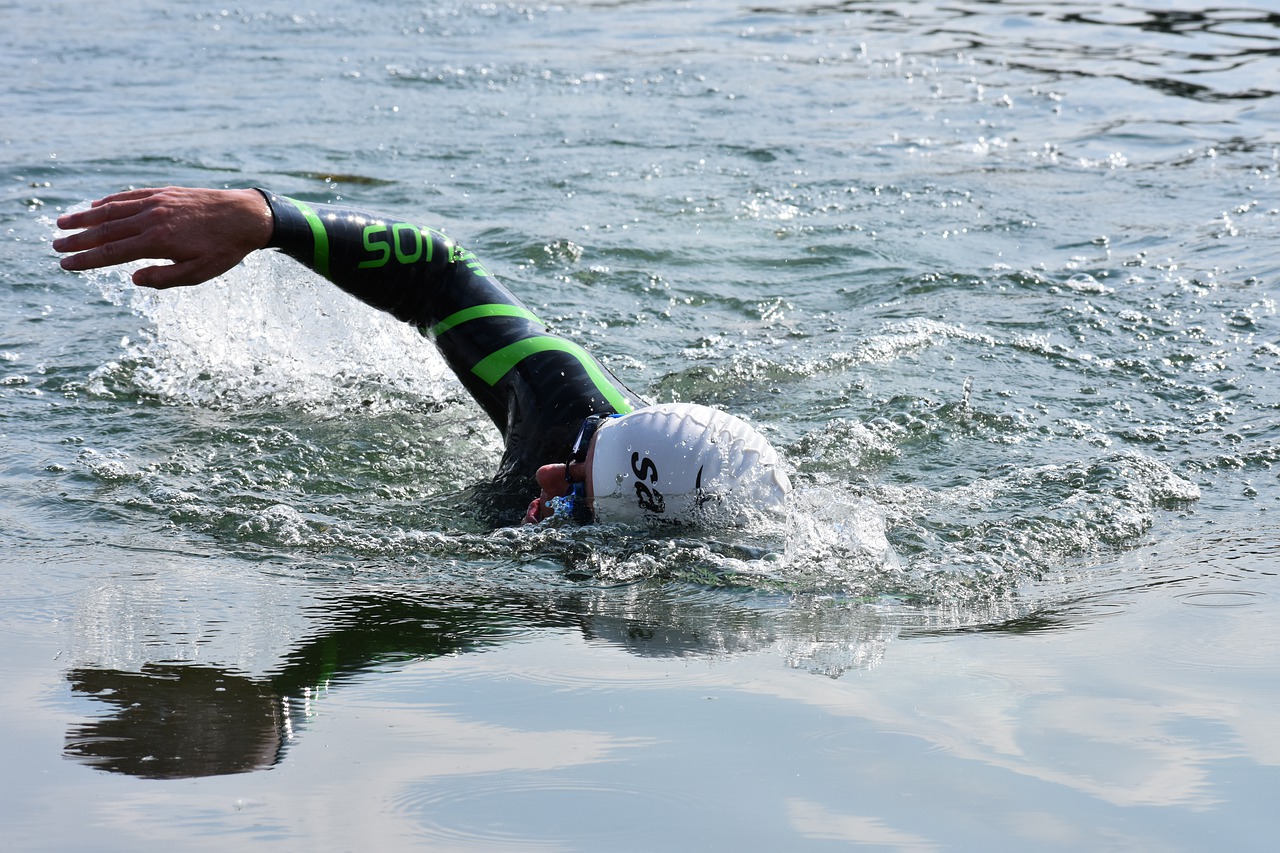 man open-water swimming